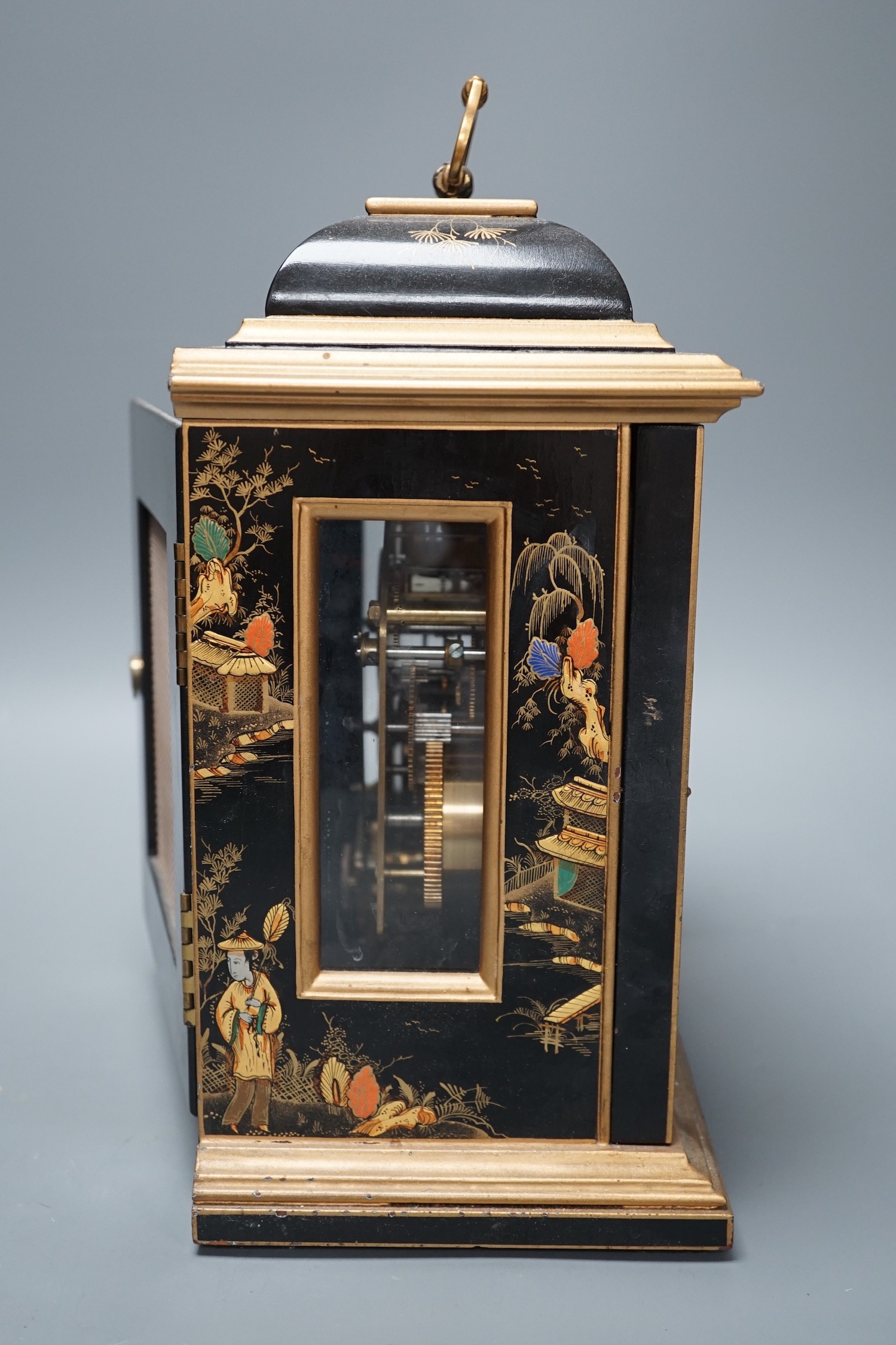 A F.W. Elliott japanned mantel clock, with chiming mechanism, 32 cms high